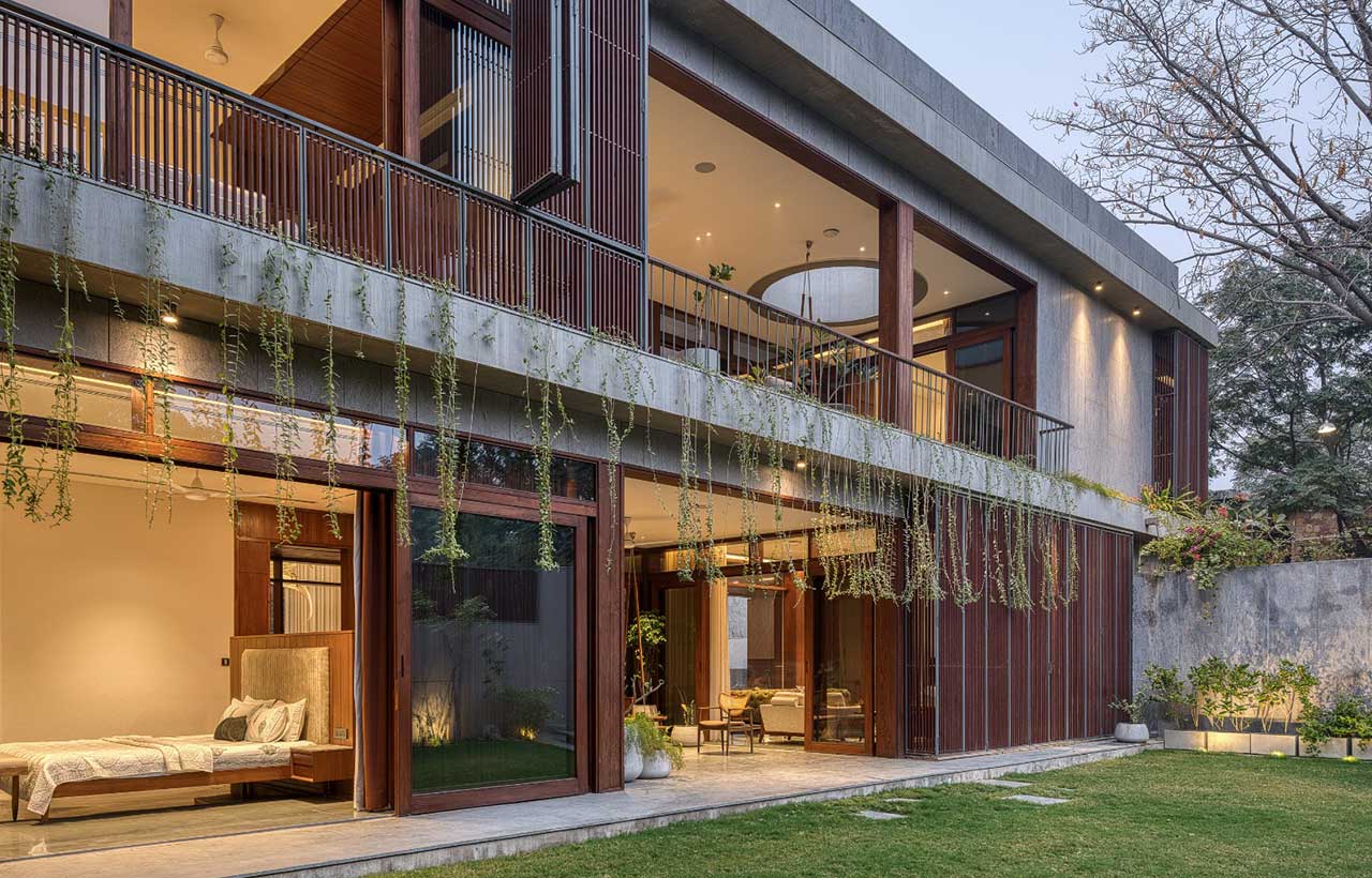 Modern house exterior with balcony garden and wooden screens Ahmedabad